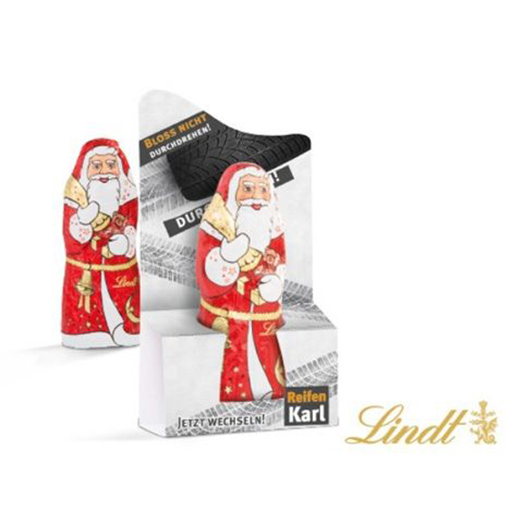 Der Schoko Weihnachtsmann Lindt 10g ist in einem Werbeaufsteller verpackt. Der Werbeaufsteller kann individuell bedruckt werden nach Wunsch.