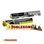 Toblerone im Werbeschuber 100g mit individuell bedruckter Banderole aus Karton.