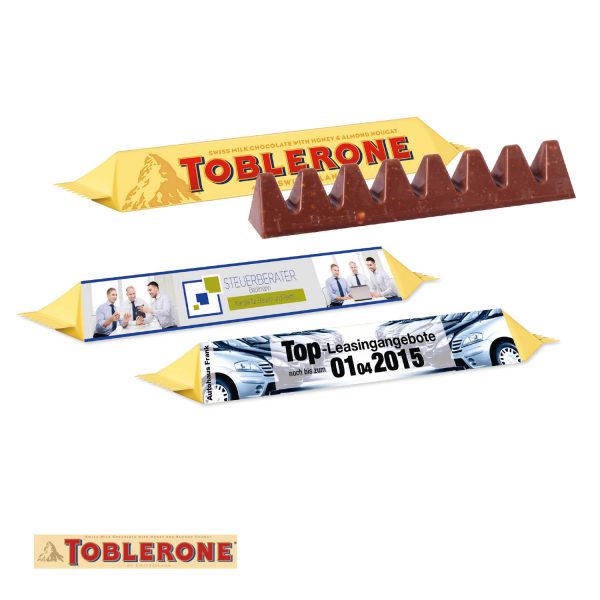 Toblerone im Werbeschuber 100g mit individuell nach Kundenwunsch bedruckter Banderole aus Karton.