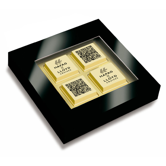 Pralinen mit QR Code bedruckt zu 4 Stück in einer Pralinenbox mit Klarsichtdeckel als Werbeartikel.
