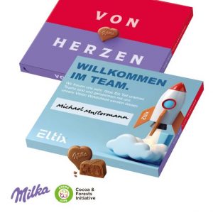 Milka Werbebox "Von Herzen" mit Werbeschuber indivifuell mit Logo bedruckt als Werbeartikel.