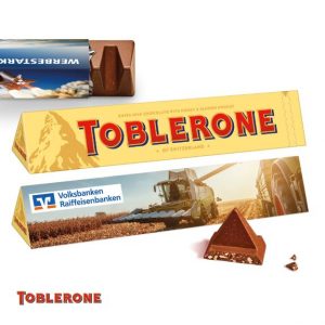 Toblerone mit Werbeschuber mit Logo individuell bedrucken als Werbegeschenk.