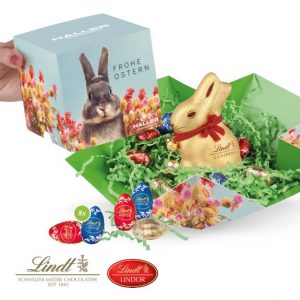 Lindt Osternest im Werbe-Würfel mit Schokoladenmischung gefüllt und mit Logo individuell bedruckt als Werbeartikel.
